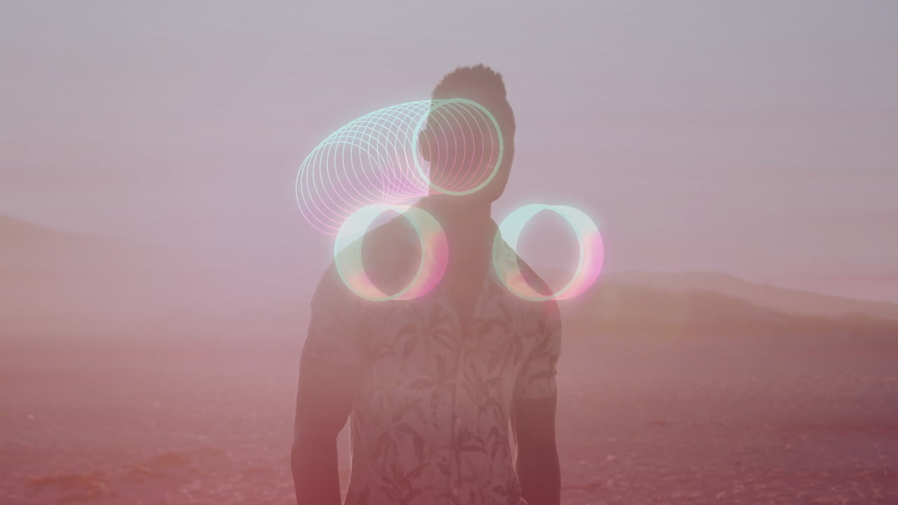 Animation of glowing circles around silhouette person in desert landscape