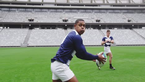 male rugby players playing rugby match in stadium 4k