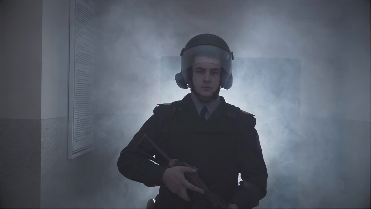Policeman in slow motion with a gun
