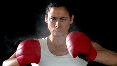 brunette punching her fists together