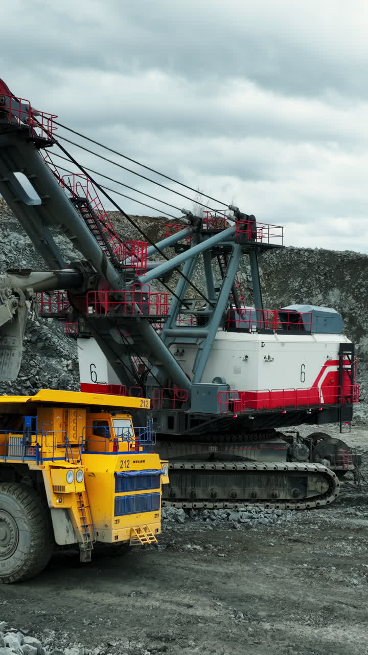 Large mining excavator and dump truck at a quarry