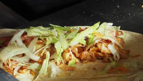 close up of a delicious chicken shawarma wrap being prepared