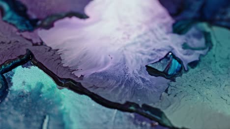 close-up of vibrant ink diffusing in water, with a dynamic mix of purple and blue hues creating an abstract art effect