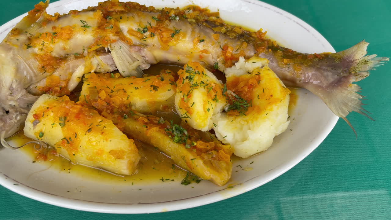 Slow pan of traditional Colombian stew with cassava and potato