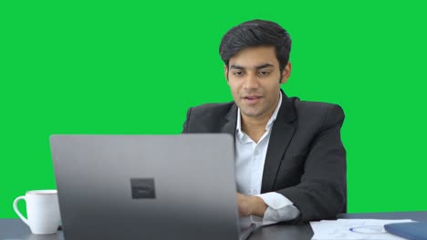 Happy-Indian-manager-working--Green-screen