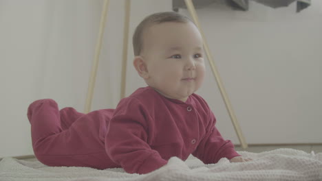 cute baby lying on the floor