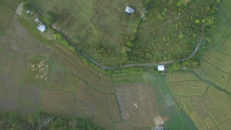 aerial view of a farm with greenhouses and fields