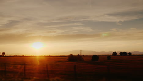 beautiful sunset in the countryside and mountains in the background