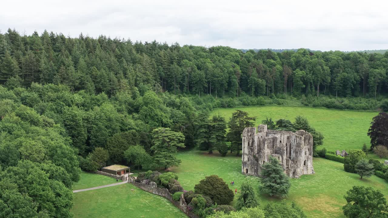 English ruins castle surrounded by gardens and woods, UK heritage tourism