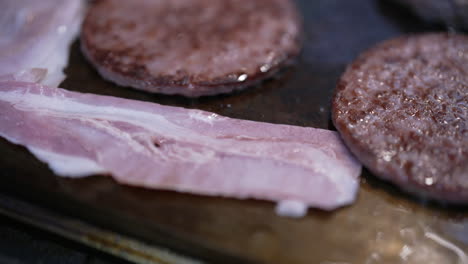 cooking burgers and bacon