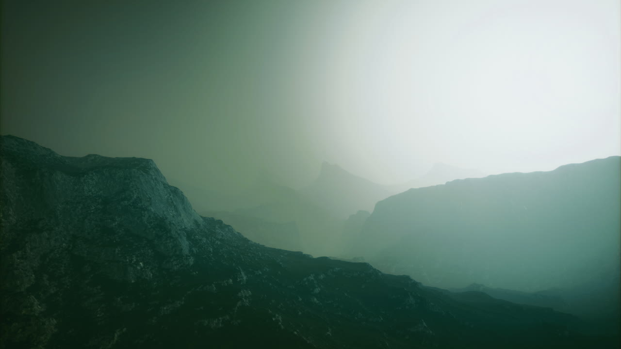 Misty mountains create a tranquil morning atmosphere