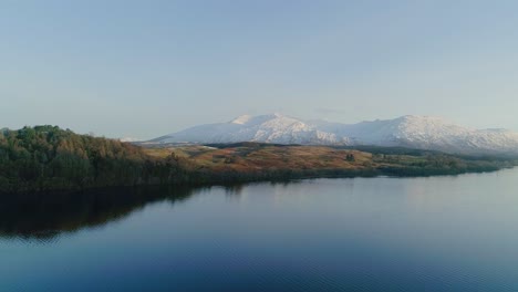 Sunrise-aerial-shot-of-a-snowy-capped-Ben-Cruachan,-a-mountain-in-Argyll-and-Bute,-Scotland