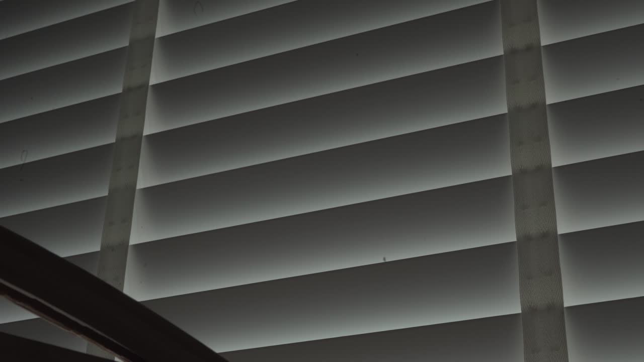 Closing shutters blinds on a window