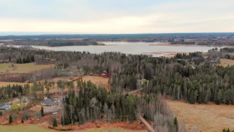 Aerial-view-of-Finnish-countryside,-Gulf-of-Finland-in-the-background