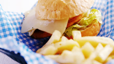 burger and french fries on table