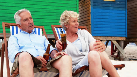 Senior-couple-interacting-with-each-other-at-the-beach