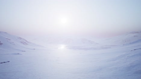 aerial landscape of snowy mountains and icy shores in antarctica