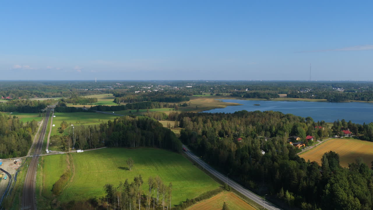 Aerial view of the railway and road Keha 3, on the countryside of Espoo, Finland