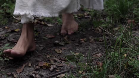 barefoot woman walking on a path