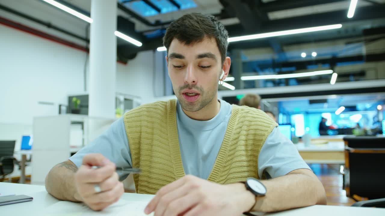 Young Handsome Man Talking on Video Call in Office