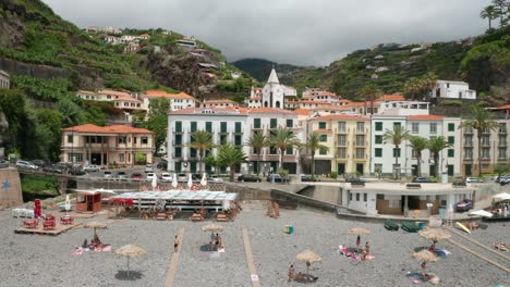 traditional portuguese buildings on seaside boulevard at ponta do sol, aerial