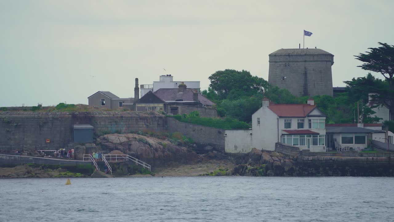 4k filmed at 60fps a castle in Dublin Ireland alongside the ocean filmed on a cold rainy day