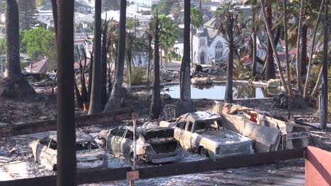 the destroyed remains of a vast apartment complex and charred vehicles overlooking the city of ventura following the 2017 thomas fire 1