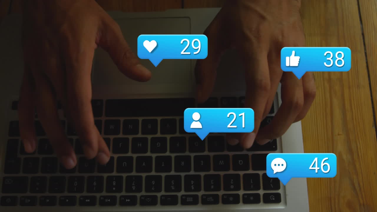 Animation of notification icons with increasing number over caucasian hands using laptop