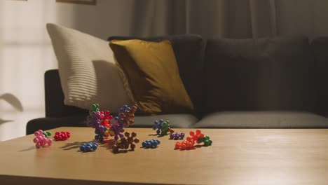 coloured interlocking shape puzzle on table at home for child diagnosed with asd 2