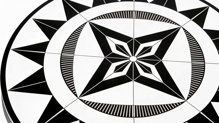 On play, rotating monochrome disc spinning clockwise overhead with central star and striped ring