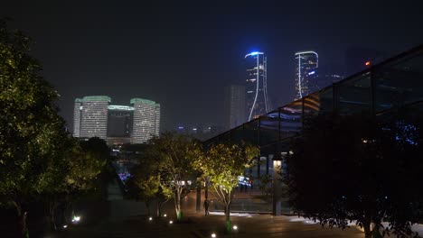 hangzhou city downtown night time illuminated famous modern buildings square top panorama 4k china