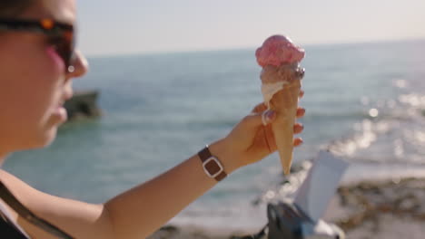 young woman taking photo of ice cream on beach using camera enjoying sunny day photographing summer vacation experience