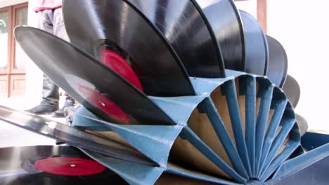vinyl records are folded as a set in a cardboard stand.