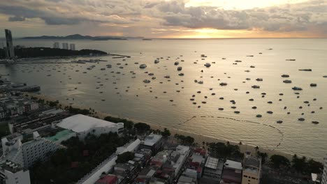 Aerial-view-of-Pattaya-beach-at-sunset-with-walking-street-famous-landmark