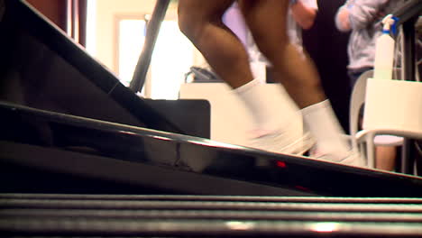 people exercising on a treadmill