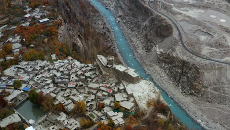 aerial of altit fort and the karakora highway along the hunza river, pakistan