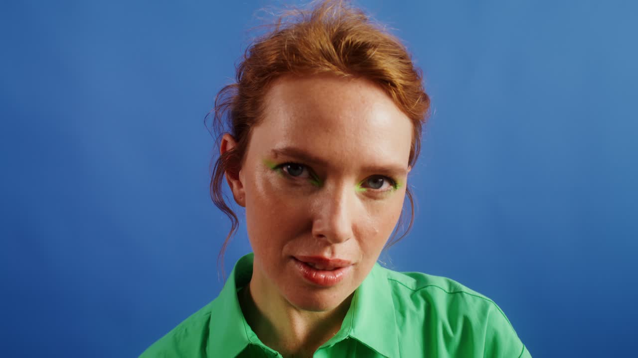Portrait of a Redhead Woman with Green Eyeshadow