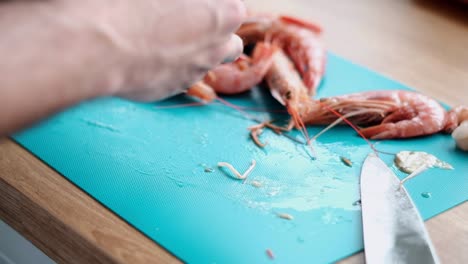 Intimate-Close-Up-of-Chef-Preparing-Argentinean-Langostinos-with-Precision