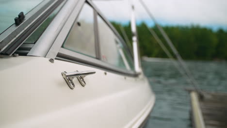 establishing shot of a boat docked and tied up