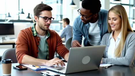 group of business people and software developers working as a team in office.