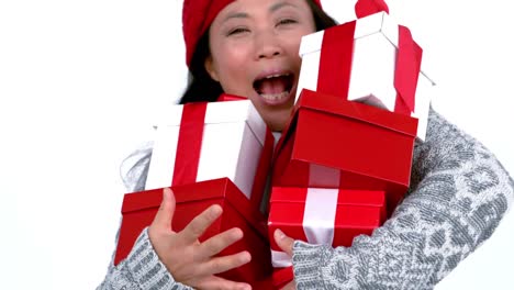 Happy-woman-holding-many-gifts-