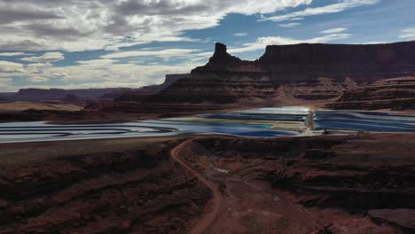 aerial view of potash chemical mines on a cloudy day in moab, utah - drone shot