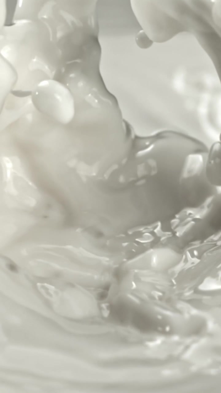 Close-up Slow Motion of White Liquid Splashing and Rippling