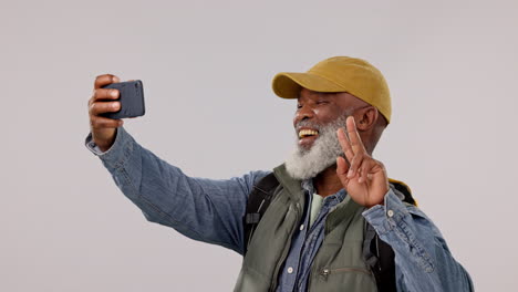 Hiking,-selfie-and-senior-man-with-peace-hands