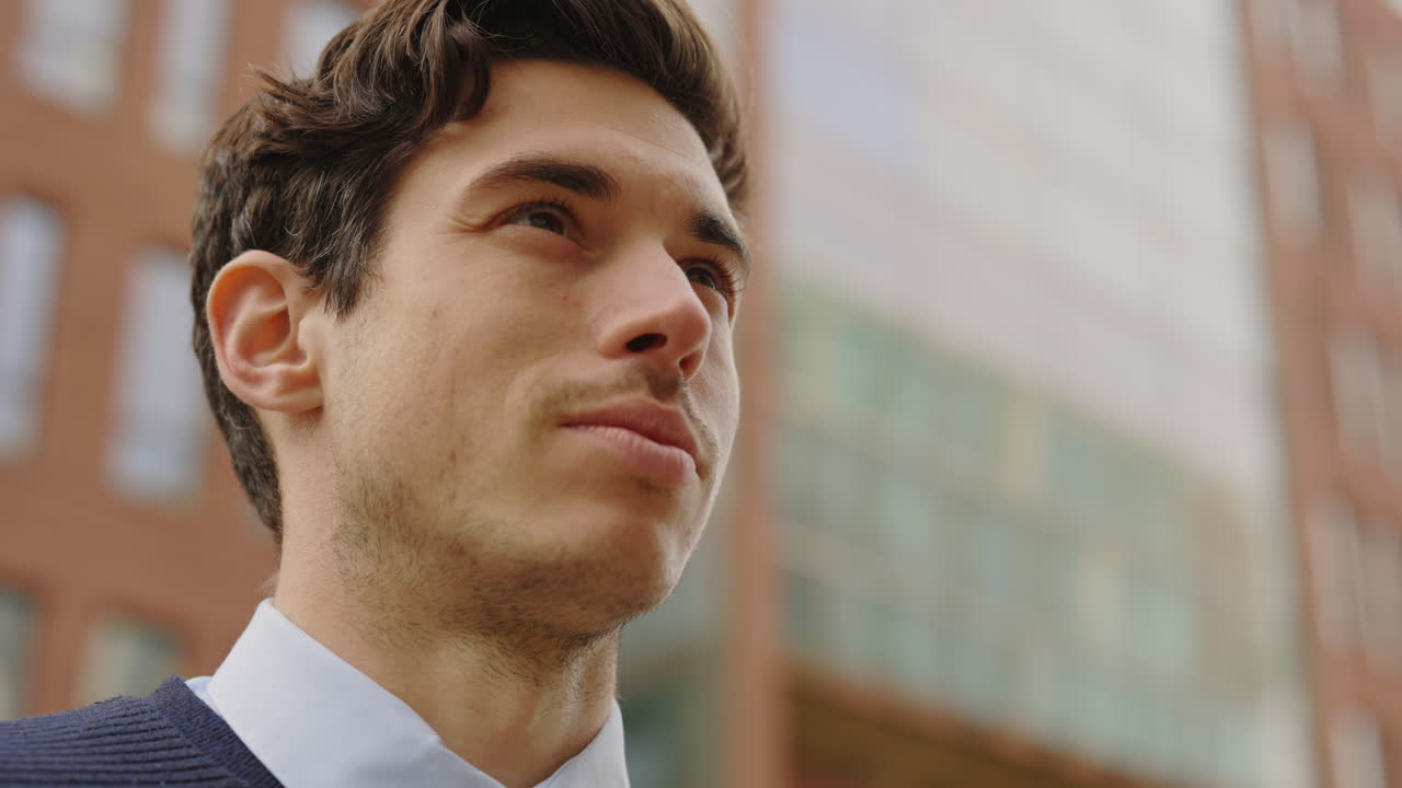Portrait of a man looking up in the city