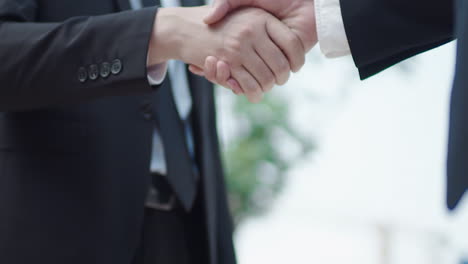 two business men shake hands to cooperate in the main conference room, brainstorming and building design agreements were discussed