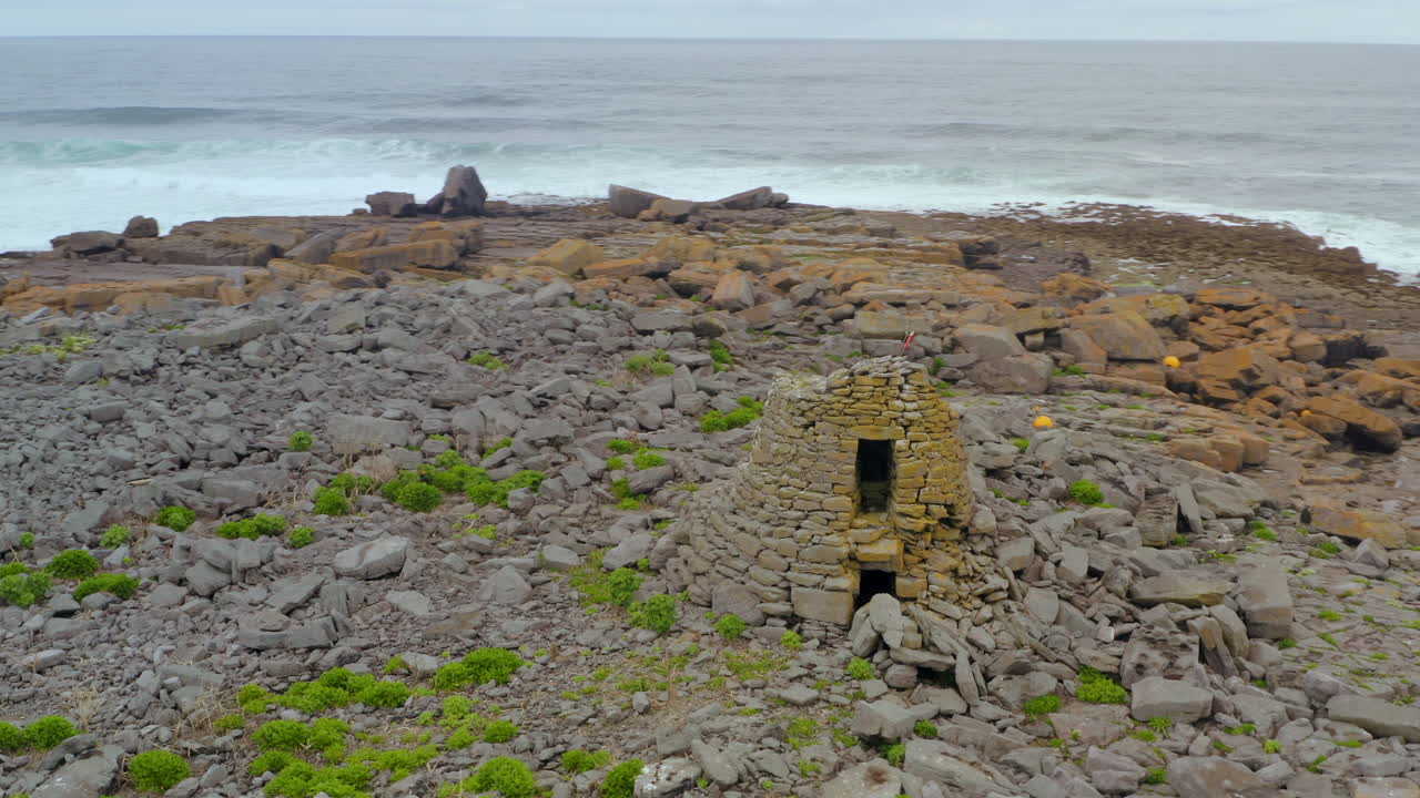 Slow motion aerial of Doolin's Constabulary outpost at Crab Island. County Clare