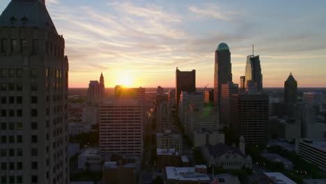 a breathtaking view captures the sunset lighting up the dallas skyline. the vibrant colors reflect off the city buildings, creating a stunning urban landscape at dusk.
