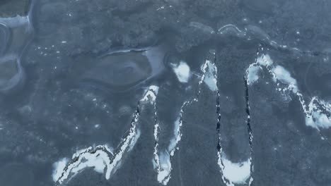 from above, a large body of water freezes in winter, and the ice will form beautiful patterns