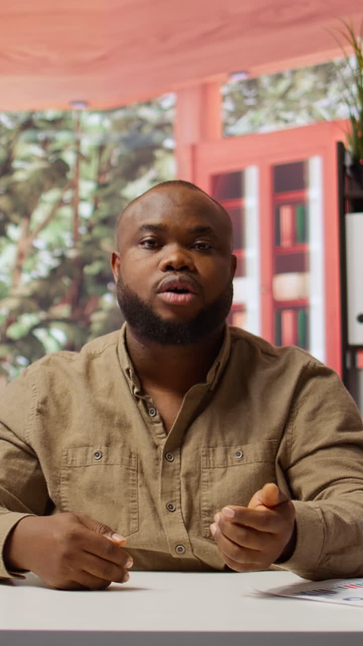 African American Man Talking and Gesturing During Video Call